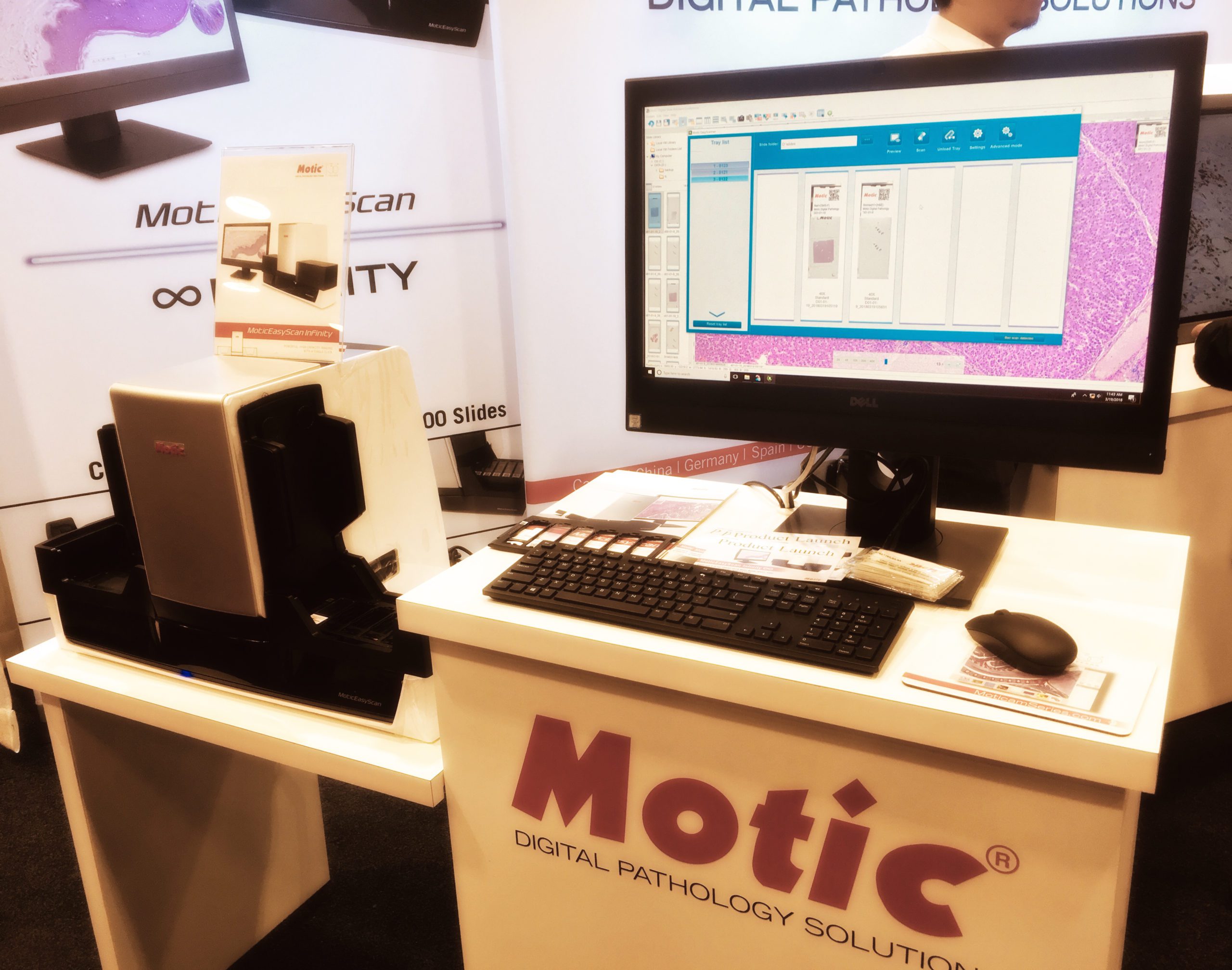 computer on a desk with motic logo announcing easy scan